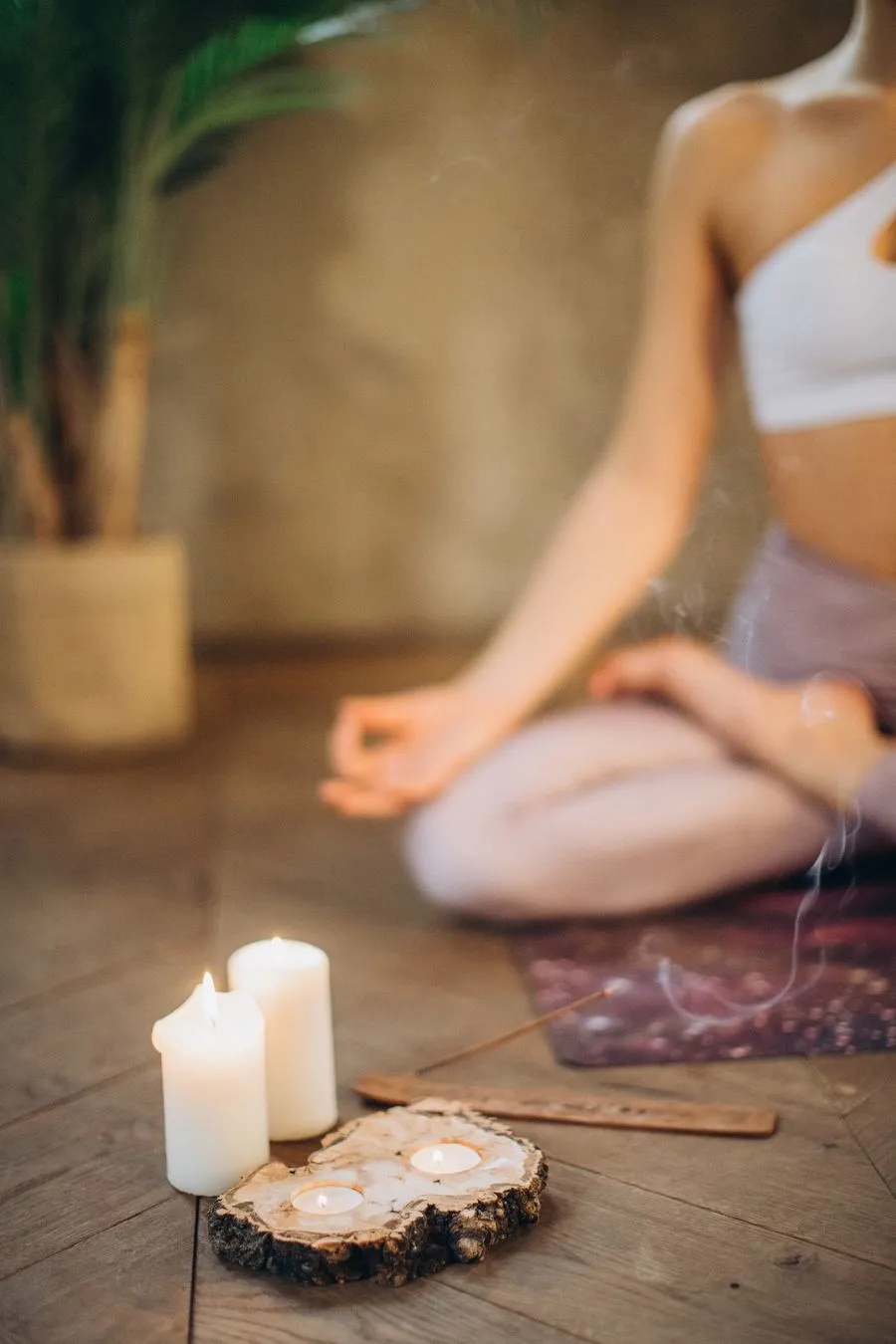 Candles and incense set up for a meditation and healing practice
