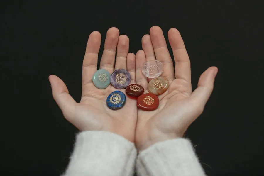 Chakra stones held in open hands
